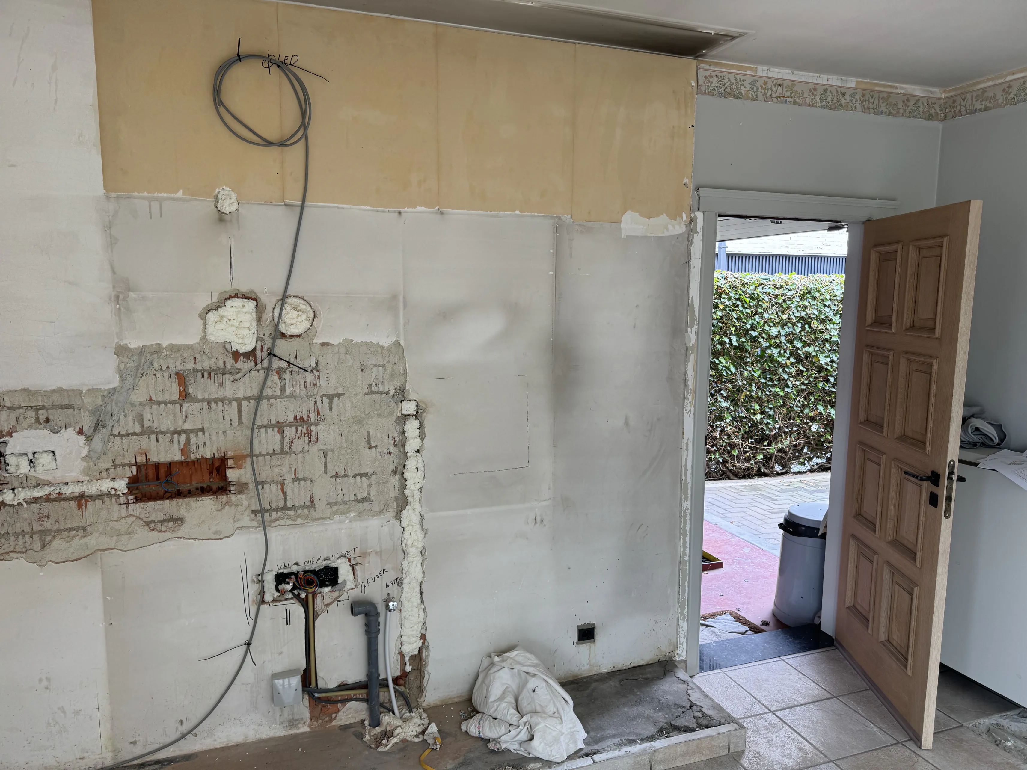 Interior with green drywall boards and scaffolding